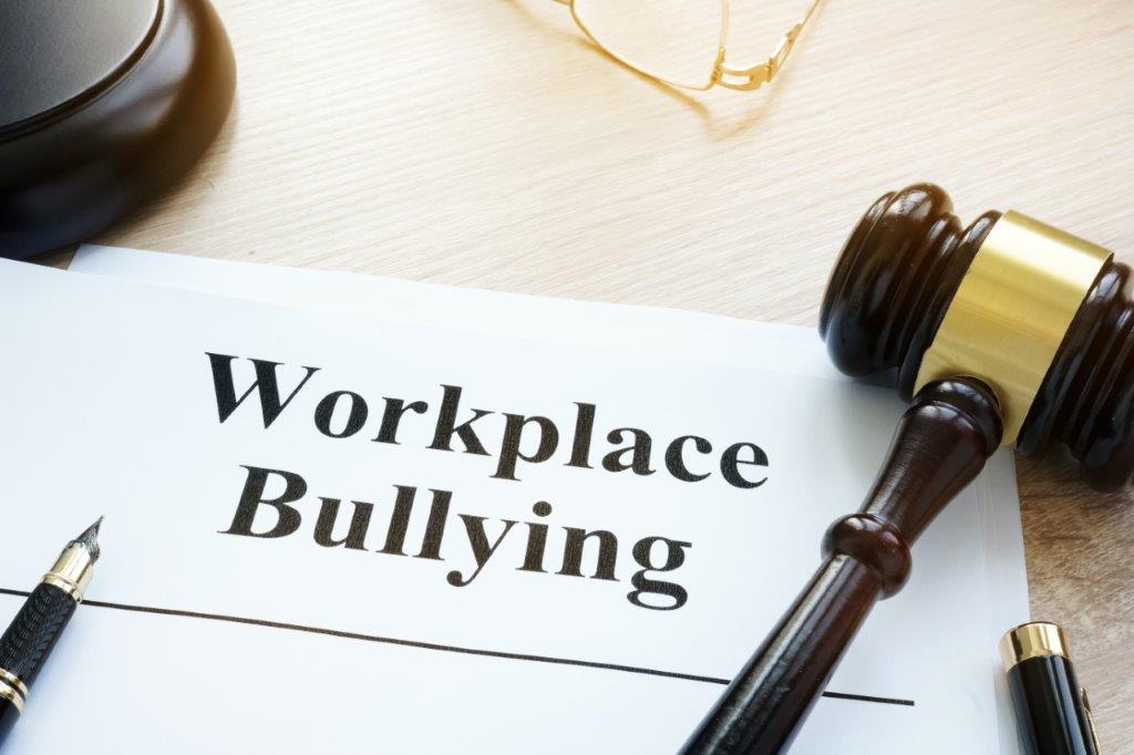 Workplace Bullying page with gavel and block next to it