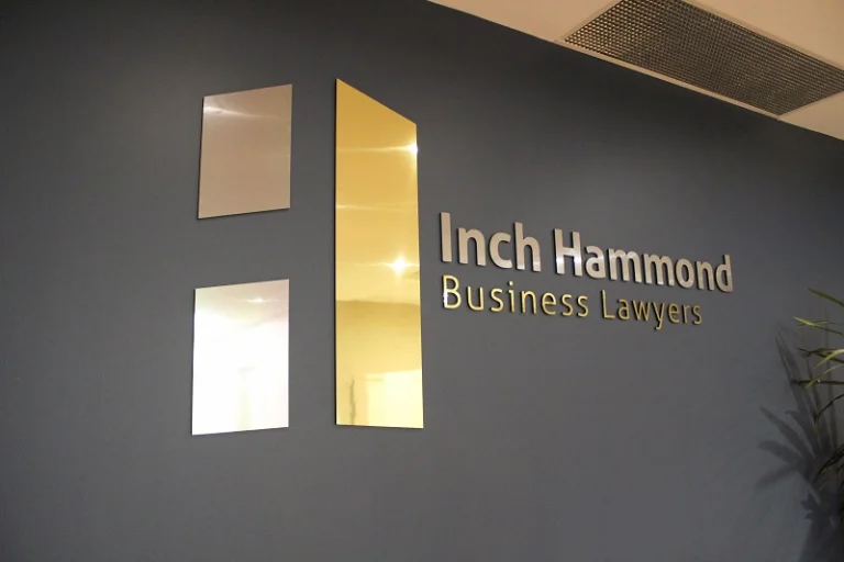 Inch Hammond logo on wall of reception area