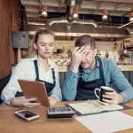 business owners struggling with financial problems.