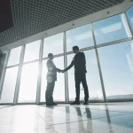 Two business men shaking hands